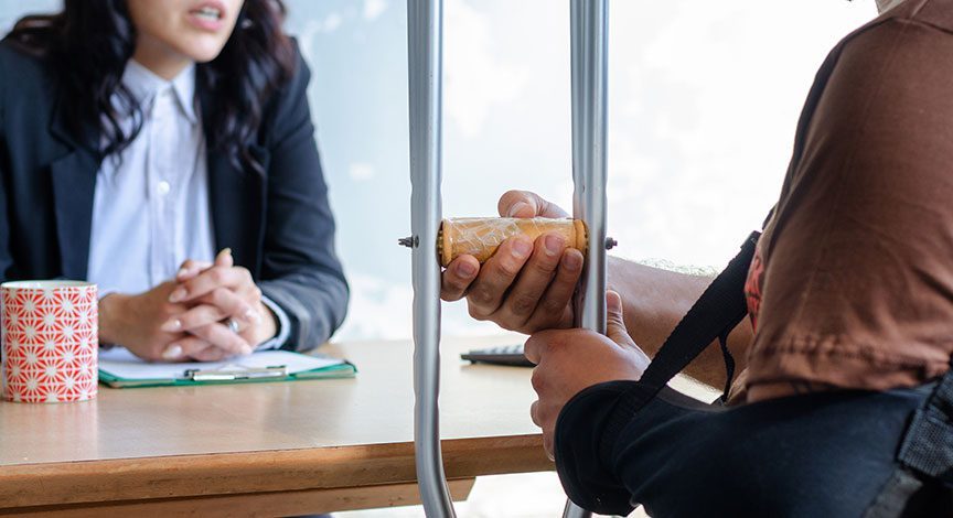 attorney-taking-notes-across-the-table-from-a-client